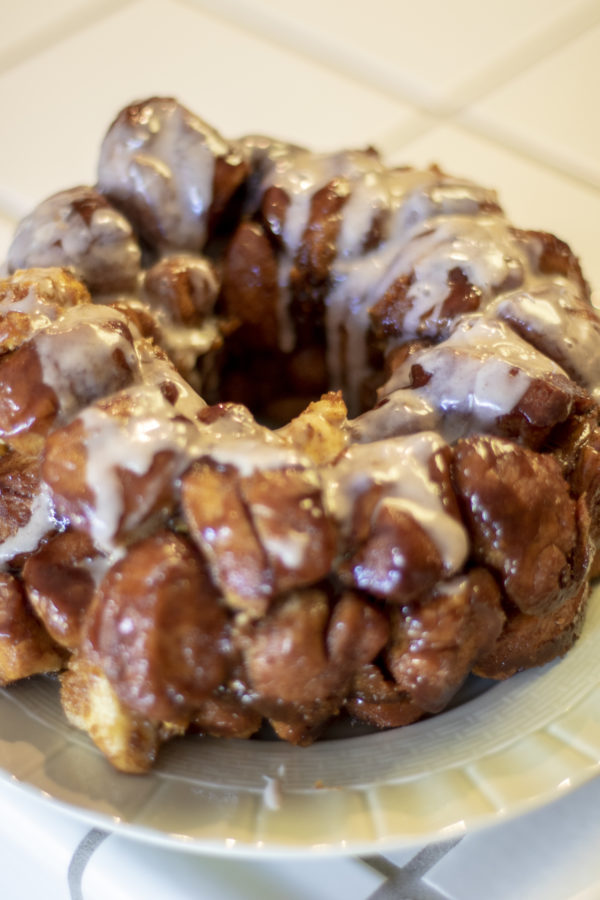 Pumpkin Monkey Bread being frosted