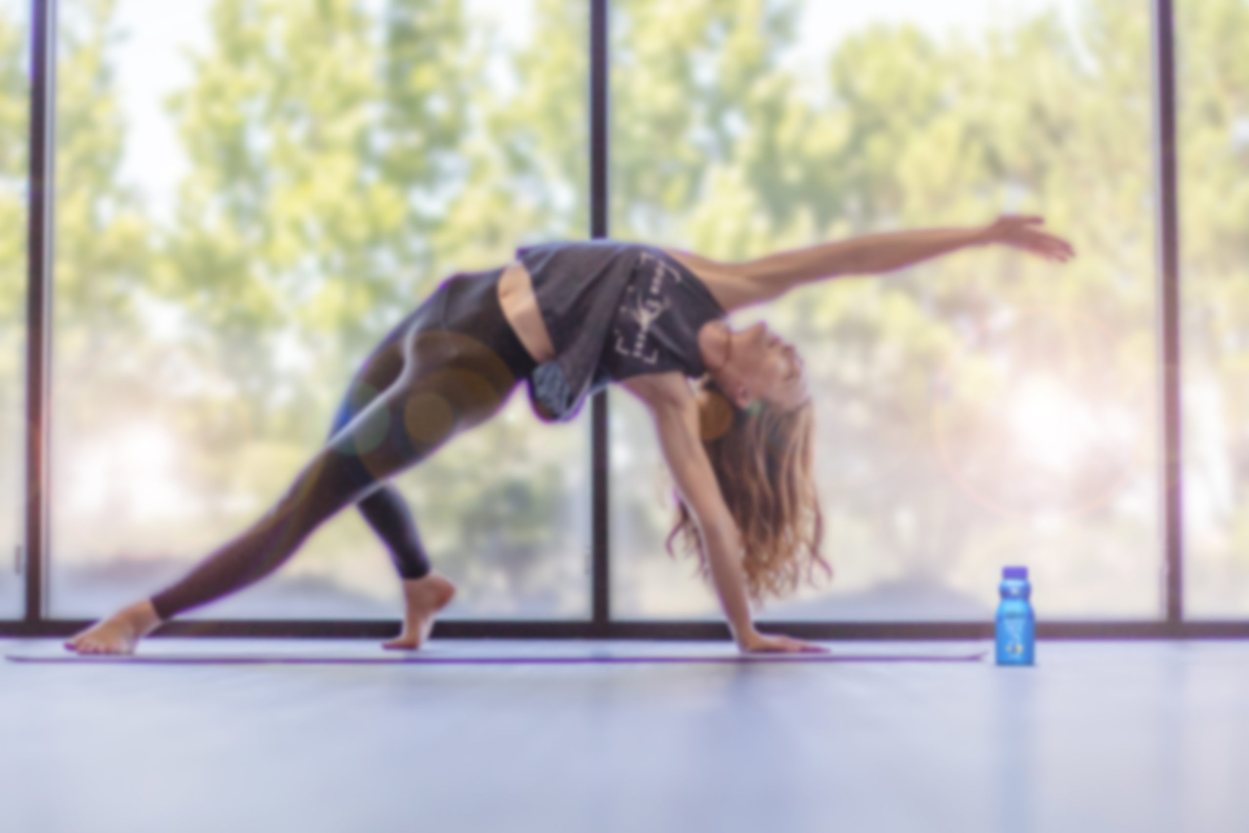 Girl doing yoga in front of a huge window with reduced fat grab n go.
